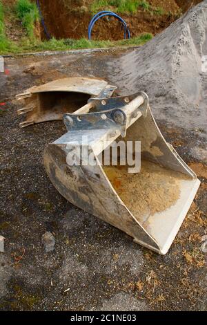 Baggerschaufel auf einer Baustelle Stockfoto
