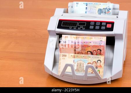 Bolivianischen Boliviano in einer zählmaschine Stockfoto