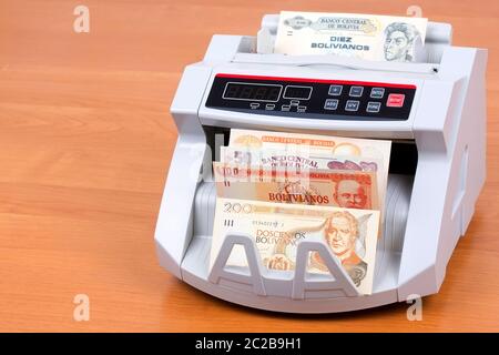 Bolivianischen Boliviano in einer zählmaschine Stockfoto