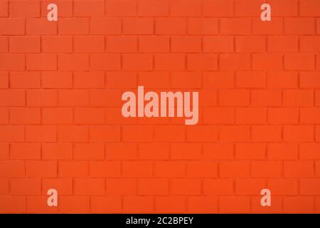 Detail einer Backsteinwand in leuchtendem Orange-Rot Stockfoto