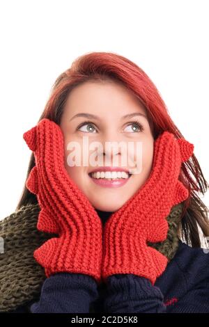 Ein Porträt eines lächelnden schönen jungen Mädchen in Rot winter handschuhe, auf weißem Hintergrund. Stockfoto