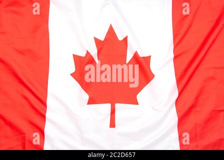 Echte Stoff Flagge von Kanada als Hintergrund oder Textur, Draufsicht, kanadische Flagge Stockfoto