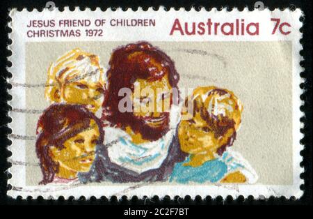 AUSTRALIEN - UM 1972: Briefmarke gedruckt von Australien, zeigt Jesus und Kinder, um 1972 Stockfoto