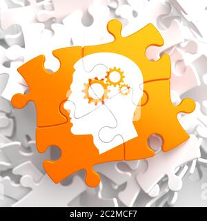 Psychologisches Konzept - Profil des Kopfes mit Zahnrad Zahnradmechanismus auf Orange Puzzle. Stockfoto