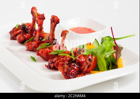 Fried Chicken Wings in Granatapfel Sauce Stockfoto