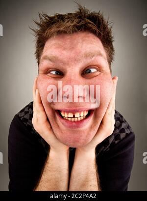 Porträt von bizarren verrückter Grimassen Stockfoto