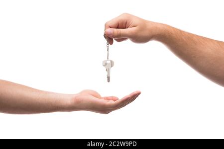 Übergabe der Schlüssel aus einer Hand zur anderen Stockfoto
