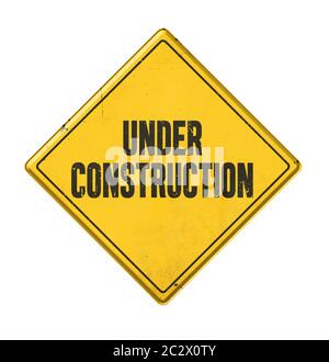 Gelbe Zeichen auf weißem Hintergrund - im Bau Stockfoto