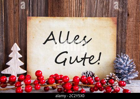 Papier mit deutschem Text alles Gute, die besten Wünsche. Weihnachtsdekoration und Holz- Hintergrund Stockfoto