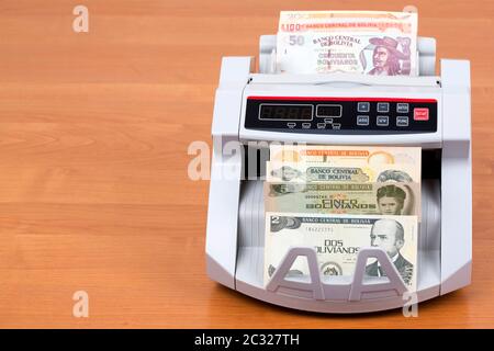 Alte bolivianische Boliviano in einer zählmaschine Stockfoto