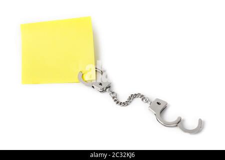 Leeres Papier mit Handschellen Stockfoto