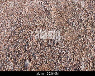 Abstrakte Makro grit Hintergrund - Oberfläche, mit kleinen Steinen bedeckt Stockfoto
