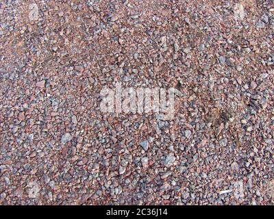 Abstrakte Makro grit Hintergrund - Oberfläche, mit kleinen Steinen bedeckt Stockfoto