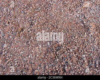 Abstrakte Makro grit Hintergrund - Oberfläche, mit kleinen Steinen bedeckt Stockfoto