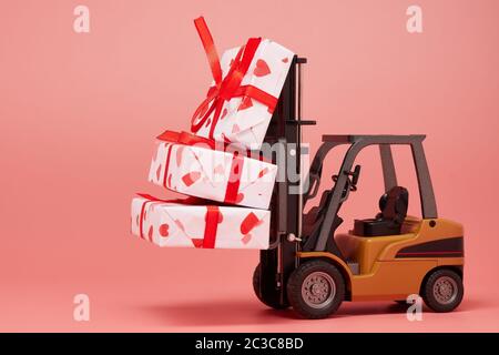 Gabelstapler und Geschenkboxen auf rosa Hintergrund mit Kopierraum. Valentinstag. Hochzeitstag Stockfoto