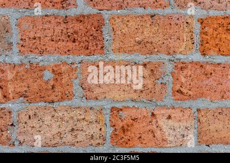 Verwitterte gefärbten alte Ziegel Wand Hintergrund. Stockfoto