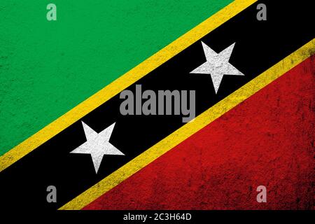 Die Nationalflaggen der Föderation der Heiligen Christopher und Nevis (Saint Kitts und Nevis). Grunge Hintergrund Stockfoto