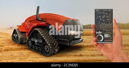 Farmer mit digitalem Tablet steuert einen autonomen Traktor und eine Drohne auf einer intelligenten Farm Stockfoto