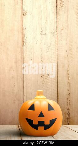 Jack-o-Lantern auf Holzboden mit Holzwand Hintergrund. Storys Vorlage für Halloween Stockfoto