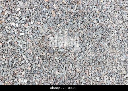 Textur von Ballast von gebrochenem Stein, Spangen, Macadam, Geröll. Hintergrund, Draufsicht. Stockfoto