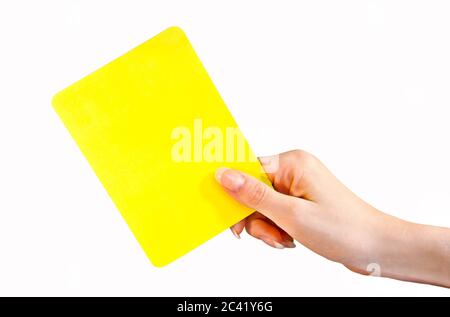 Weibliche Hand mit gelber Karte Stockfoto
