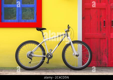 Fahrrad vor Retro Vintage Europahaus Gebäude mit roter Tür, blaues Fenster und gelbe Wand, Narrow Street Szene extreme Nahaufnahme geparkt. 3d R Stockfoto