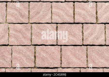 Draufsicht auf Monotone Grunge Cracked Grey Brick Marmor Stein auf dem Boden für Street Road. Gehweg, Auffahrt, Pflaster, Pflaster im Vintage Design Stockfoto