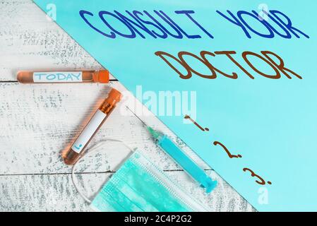 Handschrift Text Schreiben Befragen Sie Ihren Arzt. Konzeptfoto Fragen Sie Informationen oder Rat von einem Arzt extrahiert Blutprobe Fläschchen mit Stockfoto
