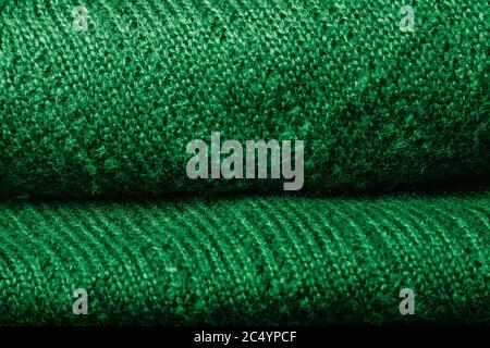 Dunkelgrün Strickstruktur Hintergrund, warme Decke oder Pullover Stockfoto