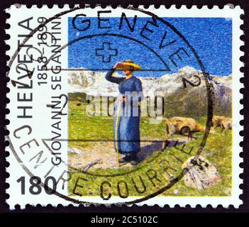 SCHWEIZ - UM 1999: Eine in der Schweiz gedruckte Briefmarke zum 100. Todestag von Giovanni Segantini zeigt Mittag in den Alpen Stockfoto