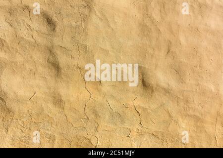Hintergrund gelb, beige verputzte Wand Stockfoto