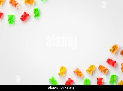 Gelee Gummibärchen trägt Süßigkeiten Hintergrund. Obst Gummi Süßigkeiten Frame Thema. Rot, orange, gelb und grün. 3d-Rendering Stockfoto