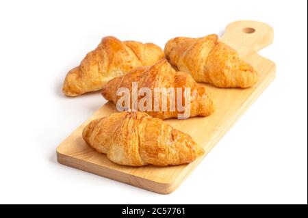 Frisch gebackene Croissants auf Holz Schneidebrett Stockfoto