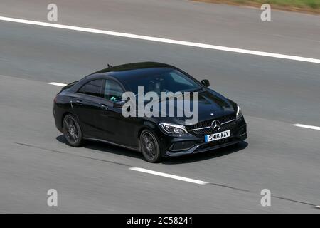 2016 Mercedes-Benz CLA 220 D AMG Line Auto Fahren auf der M6 bei Preston in Lancashire, UK Stockfoto