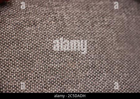 Hintergrund von beige braun und schwarz Fäden Textil-Textur Nahaufnahme Stockfoto