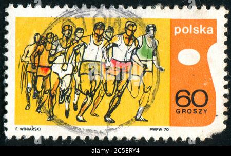 POLEN - UM 1970: Briefmarke gedruckt von Polen, zeigt Läufer, um 1970. Stockfoto