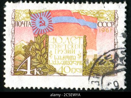 RUSSLAND - UM 1961: Briefmarke gedruckt von Russland, zeigt Flagge, um 1961. Stockfoto