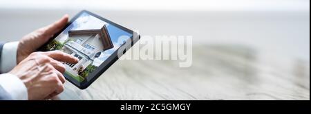 Mann, Der Auf Dem Digitalen Tablet Über Den Touchscreen Die Option „Zuhause“ Wählt Stockfoto