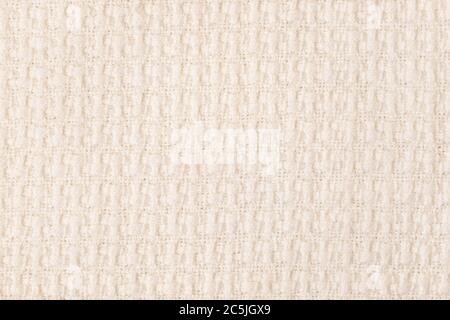 Beige gestrickte Stoff Textur Hintergrund. Nahaufnahme Stockfoto