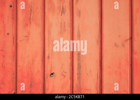 Fröhliche Farbe Hintergrund von orange verwitterten Holz mit vertikalen Dielen. Stockfoto