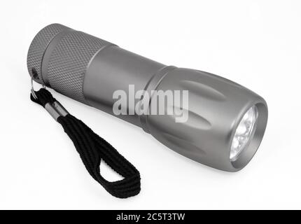 Graue Tasche LED Taschenlampe isoliert auf einem weißen Hintergrund. Beschneidungspfad enthalten. Stockfoto