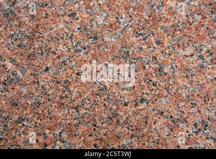 Rote Granit oder Marmor Oberfläche für dekorative Arbeiten. Stockfoto