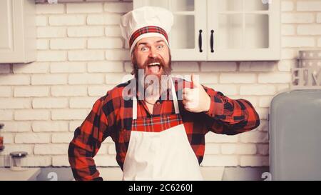 Professioneller Koch Mann zeigt Zeichen für lecker. Stockfoto