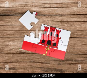 Gibraltar Nationalflagge auf Puzzle. Ein Stück fehlt. Gefahrenkonzept. Stockfoto