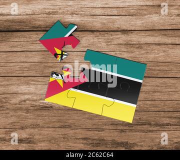 Mosambik Nationalflagge auf Puzzle. Ein Stück fehlt. Gefahrenkonzept. Stockfoto