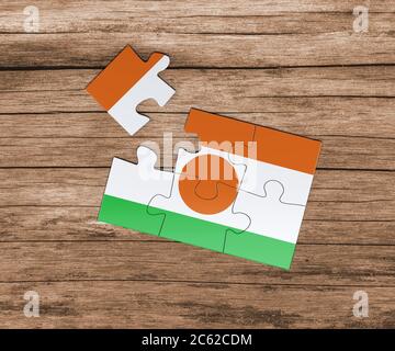 Niger Nationalflagge auf Puzzle. Ein Stück fehlt. Gefahrenkonzept. Stockfoto