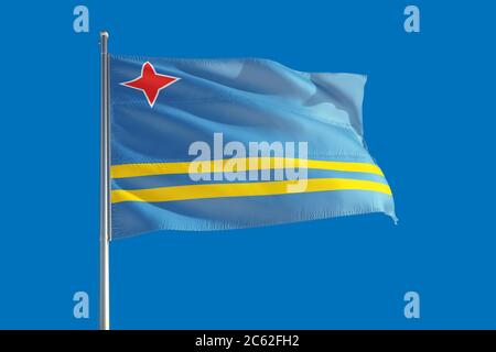 Aruba Nationalflagge winkt im Wind an einem tiefblauen Himmel. Hochwertige Qualität. Konzept der internationalen Beziehungen. Stockfoto