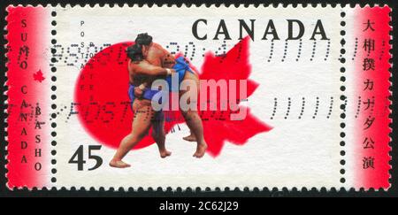 KANADA - UM 1998: Briefmarke gedruckt von Kanada, zeigt Sumo, um 1998 Stockfoto