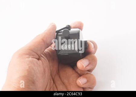 Tally-Zähler isoliert gegen Weiß Stockfoto