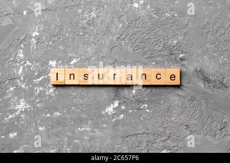 Versicherung Wort auf Holz Block geschrieben. Versicherung text auf Tisch, Konzept. Stockfoto